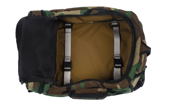 An open Techonaut 30 with a Beaver Camo (Camouflage pattern with green, brown, tan, and black) exterior and a Coyote (tan) interior.